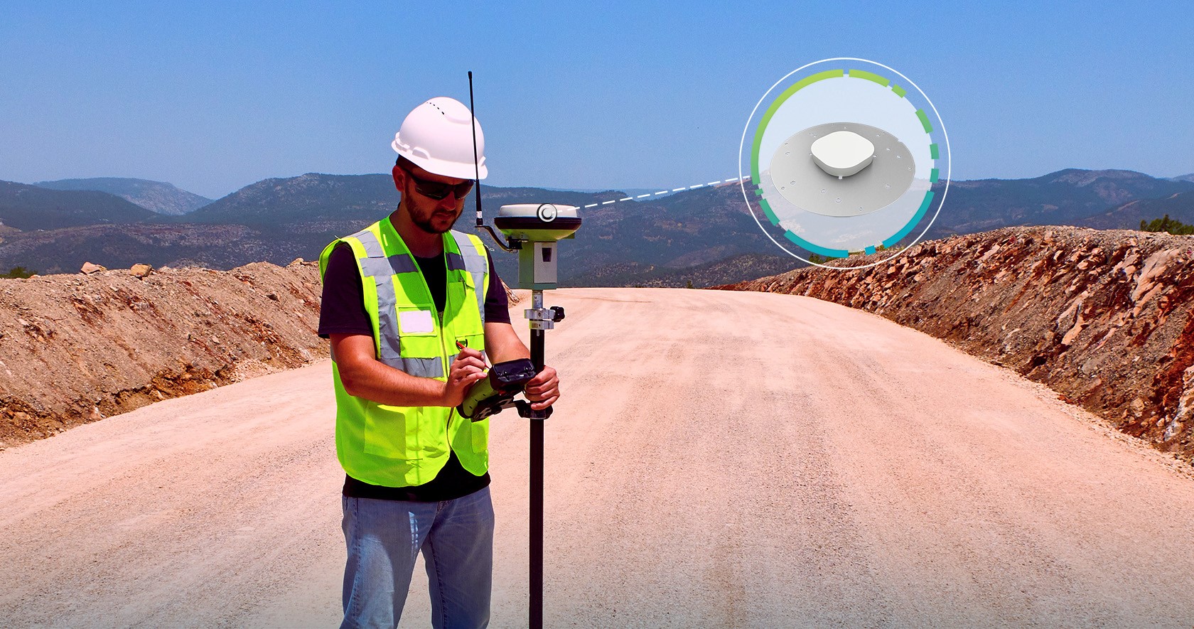Surveyor holding a pole mounted antenna with a callout to an Antcom G5Ant-5 antenna